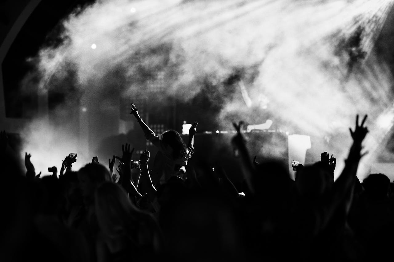 Group of People Raising Their Hands